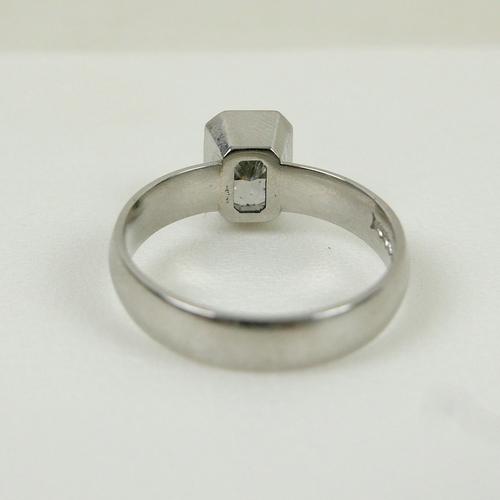 DIAMOND AND PLATINUM SOLITAIRE RING. the emerald cut diamond ...