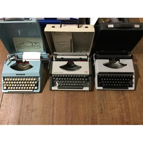 77 - 3 vintage type writers