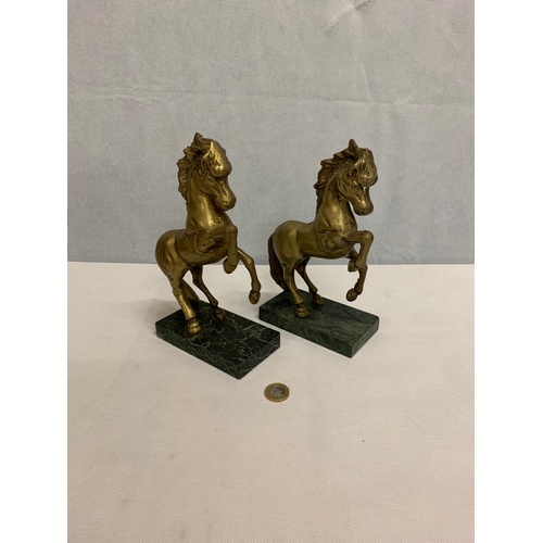 23 - Pair of brass horses.