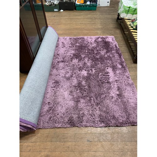 45 - Large purple rug.