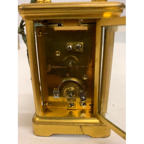 49 - Minature Victorian carriage clock with travel case. In working order, comes with original key. See P... 