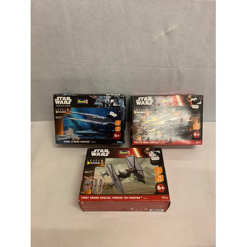 54 - 3 boxed Star Wars models.