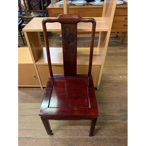 89 - Dark wood, round, extending Oriental style dining table with 4 matching chairs.