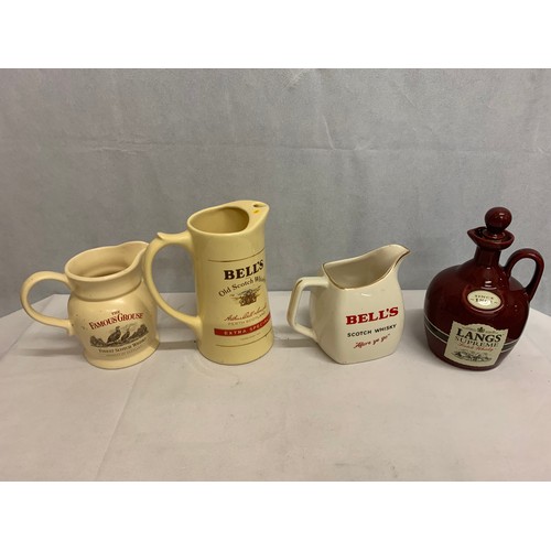 355 - 4 vintage pub advertising jugs.