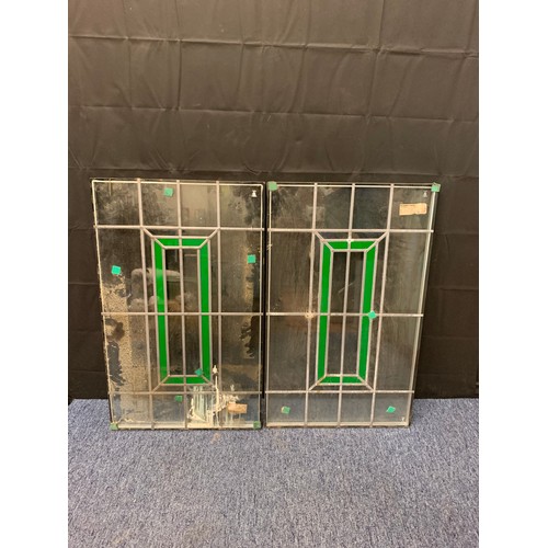 415 - Two stained glass window panels. 91cm x 56cm