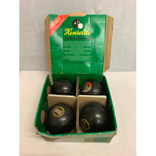 427 - Boxed set of 4 Henselite lawn bowls.