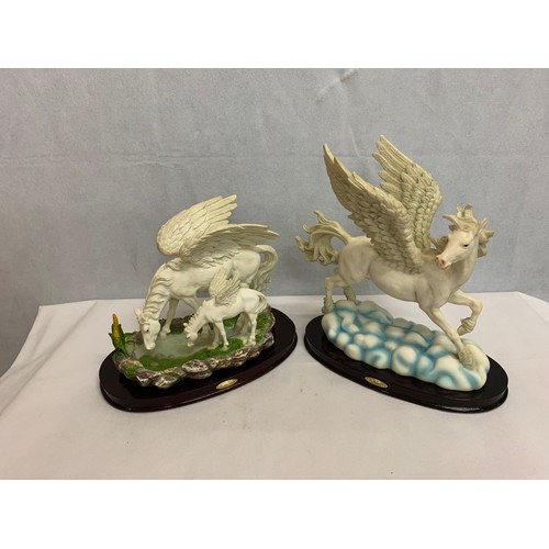 497 - Pair of Pegasus ornaments.