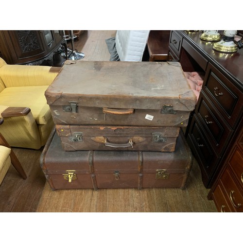 19 - Two vintage suitcases and one travel trunk.