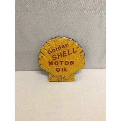 65 - Cast Iron golden shell sign.