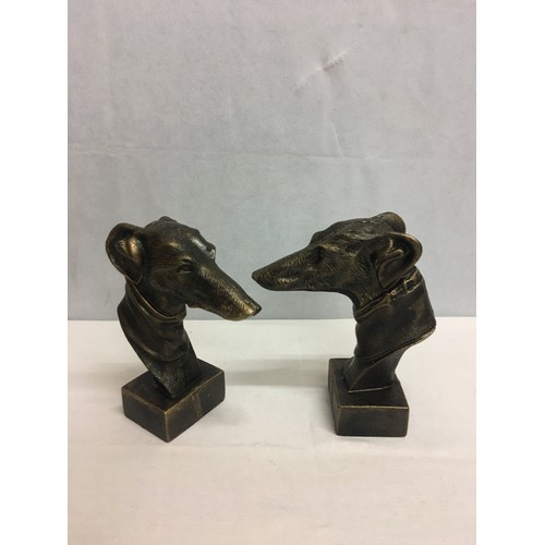 86 - Pair of cast iron greyhound busts. 22cm tall