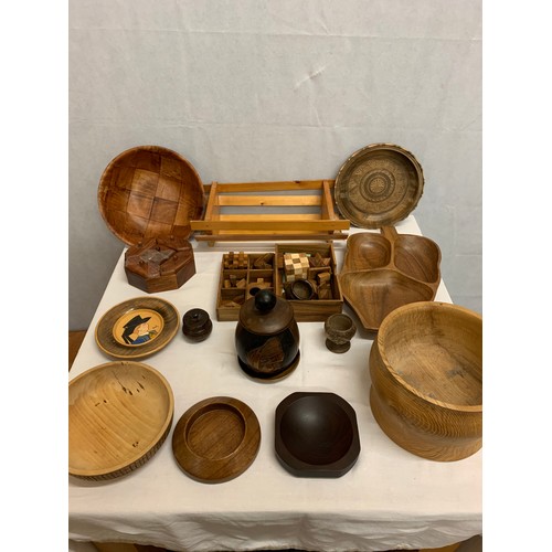 130 - Collection of wooden items to include puzzles etc.