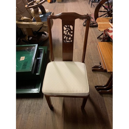 208 - Oriental Rosewood dining table with eight matching chairs. Mint condition.