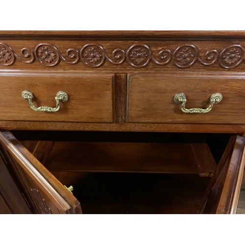 209 - Large rosewood 4 drawer/4 door sideboard/cabinet with brass fittings.