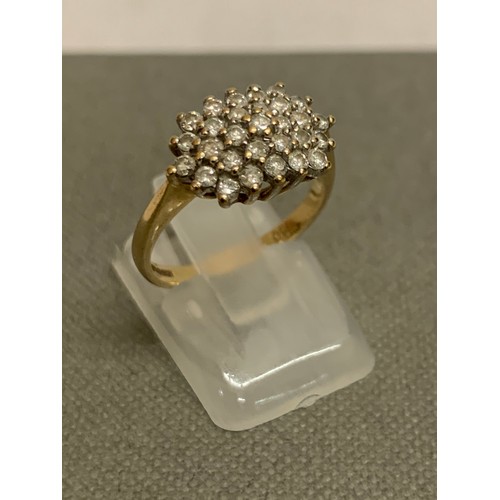 310 - 9 ct gold and diamond cluster ring. Half carat of diamonds.