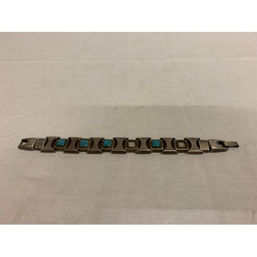 337 - possibe silver bracelet with turquoise stones.