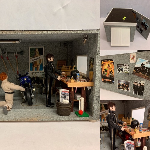 385 - Mock up of street motorbike garage with props, posters, motorbikes, figure etc. Has electrics. 22x38... 