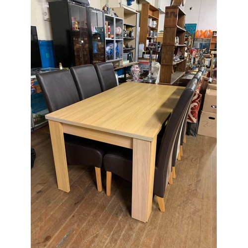 394 - Modern dining table with 6 leather chairs.