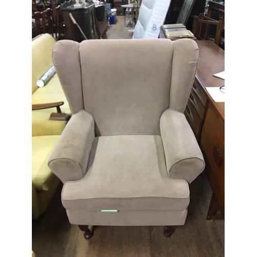 395 - Upholstered wing back chair.