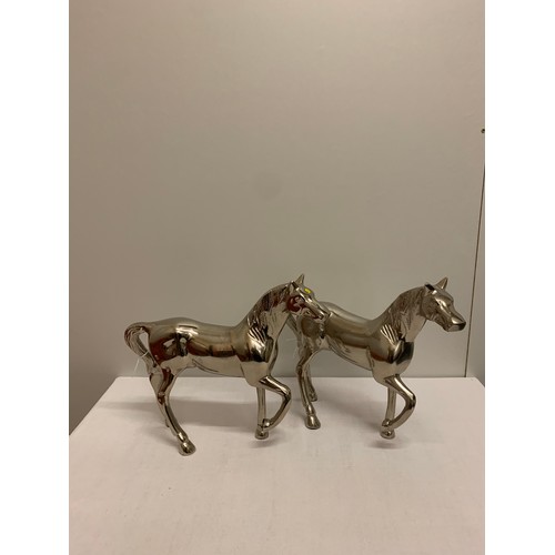 62 - Pair of chrome prancing horses.