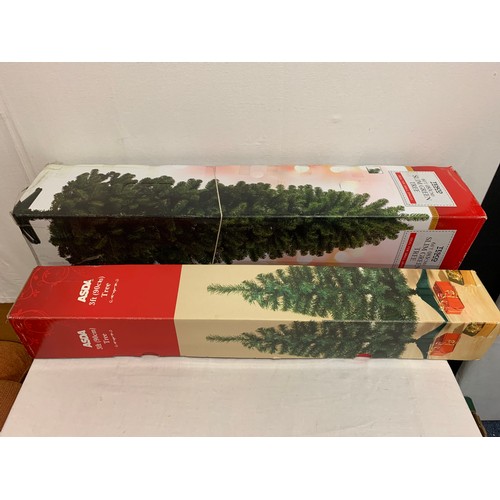 498 - 2 boxed Christmas trees.