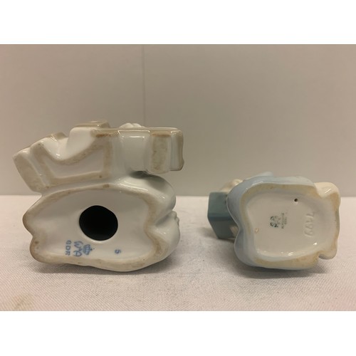 114 - Metzler and Ortloff kneeling child figure along with Wagner and Abel boy with toy train figure.