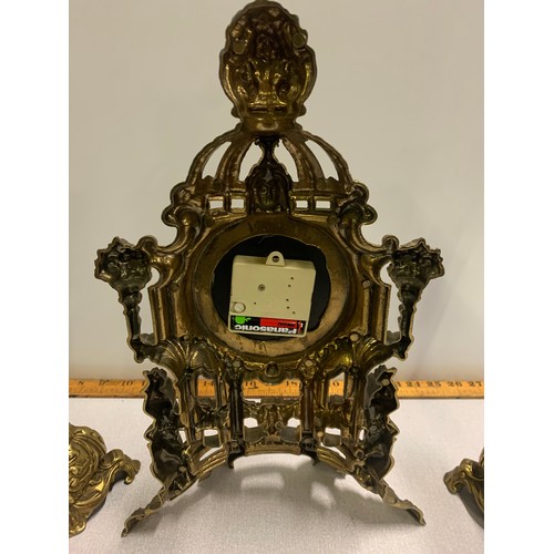 37 - Ornate brass mantle clock (battery operated) and garnitures.