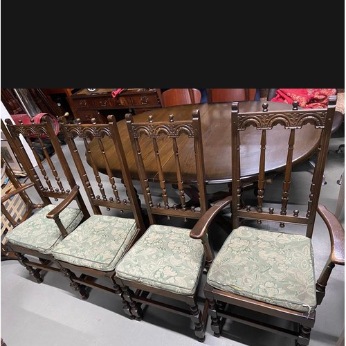 35 - Ercol elm wood dining table with leaf Centre, along with 4 Ercol high back chairs.