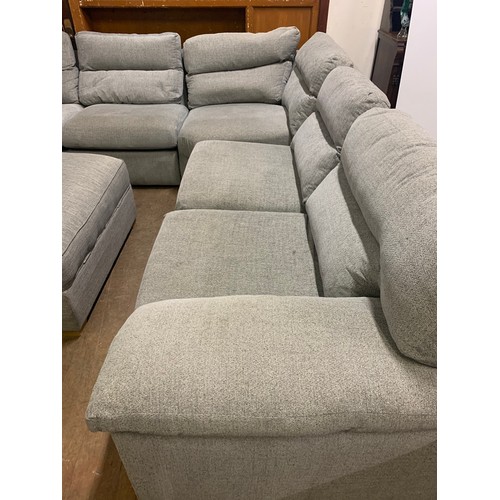 130 - Large grey, fabric corner sofa with matching storage foot stool. See pics.