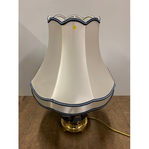 146 - Hand painted table lamp on brass base.