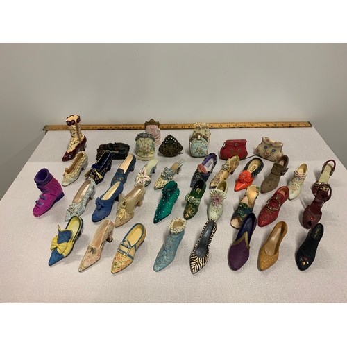 164 - Collection of shoe and handbag ornaments.