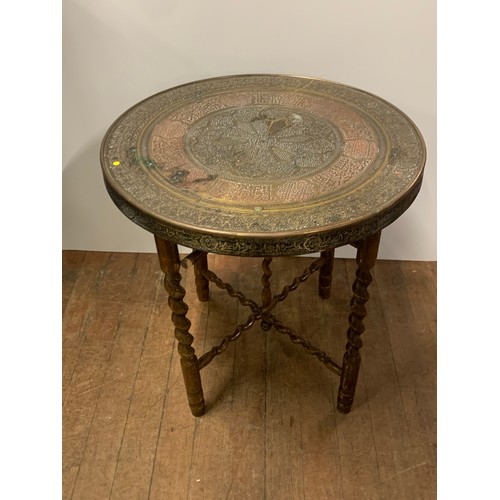 197 - Indian brass topped table on barley twist legs.