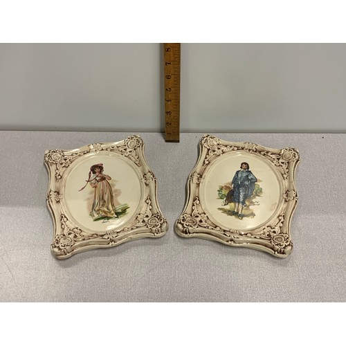 201 - Pair of ceramic portrait plaques marked to back.