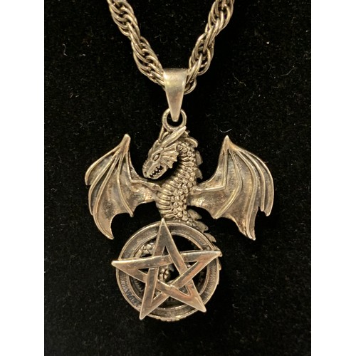 217 - Silver chain with large silver dragon and pentagram pendant.