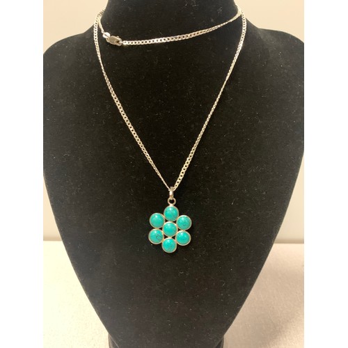 220 - Long silver chain with silver and jade look flower pendant.