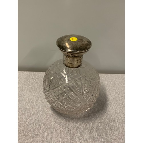 201a - Silver topped perfume bottle.