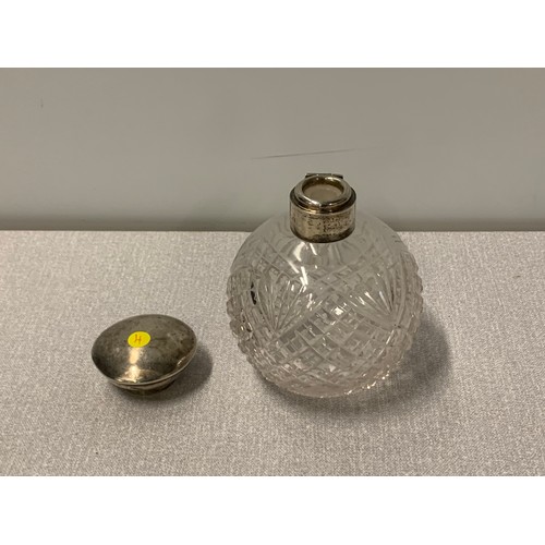 201a - Silver topped perfume bottle.