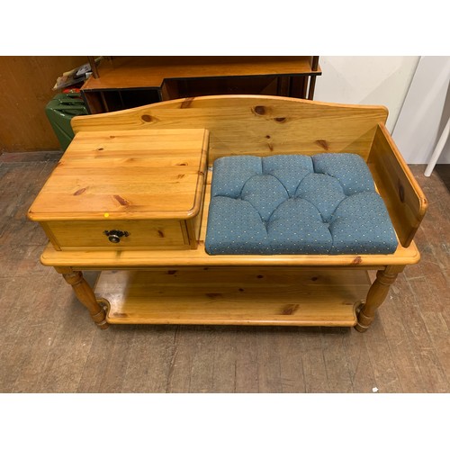 106 - Solid pine telephone table/seat with upholstered cushion.
