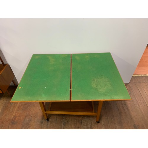 166 - Vintage flip-top games table on casters.