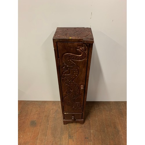 171 - Solid wood cabinet with carved dragon design. 98cm