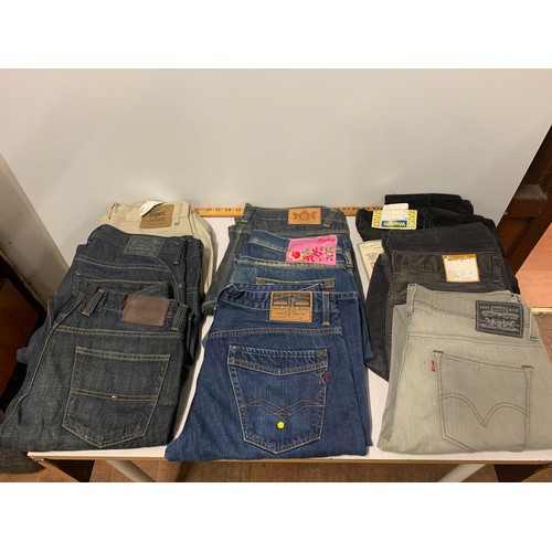 287 - 9 x pairs of designer jeans to include Lacoste, Diesel, Hilfiger, Replay, Wrangler and Levi. Some ne... 