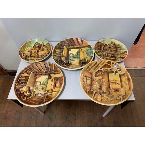 413 - Set of five cottage scene wall plaques.
