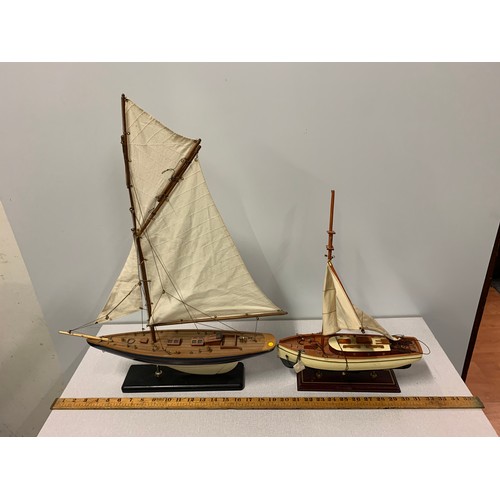 2 - 2 vintage wooden model yachts 44cm and 63cm tall.