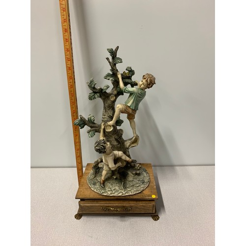 15 - Large Italian Capodimonte porcelain figure of boys climbing tree on wooden stand with drawer. Approx... 