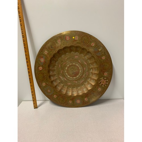 73 - Large Indian brass wall hanging depicting snake and peacocks diameter 58cm.