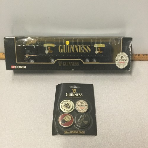 12 - Boxed Corgi Guinness lorry along with Guinness badge pack.