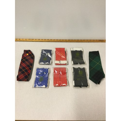 21 - 6 x sets of highland sock flashes and 2 tartan ties.