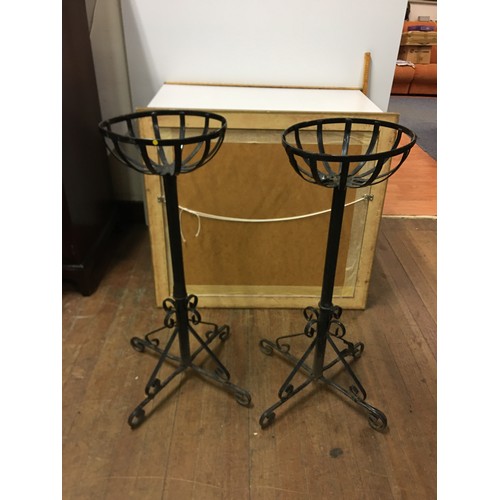 66 - Pair of standing wrought iron flower baskets holders.
86cm tall