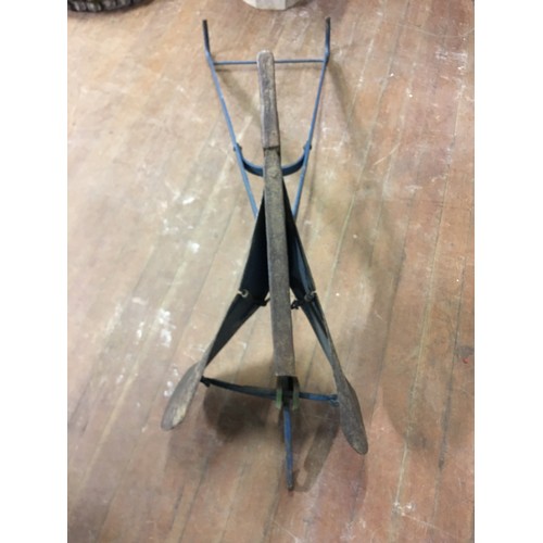 68 - Vintage hand held, cast metal furrow plough.
110cm long