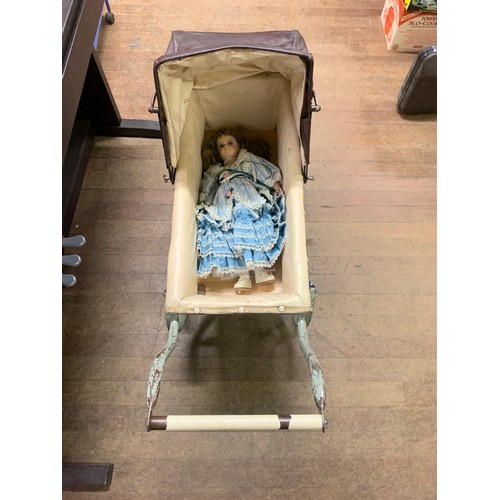 80 - Antique dolls pram with vintage porcelain doll.
72cm l x 73cm h