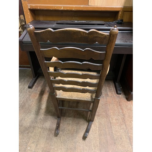 91 - Vintage solid wood, ladder back rocking chair.